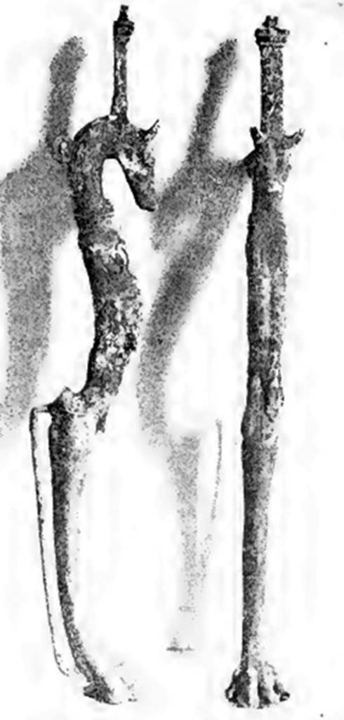 Villa of T. Siminius Stephanus, fondo Barbatelli. 24th November 1899. Found at a depth of 3.80m, found between the ash layers. Two of three table feet, well executed, the top finished with a head of a bitch, and the lower finished with a canine paw: The bitch had a collar and two tiers of breasts. There were traces of silver coating. See Notizie degli Scavi di Antichit�, 1899, p. 441-2, fig. 4a, 4b.