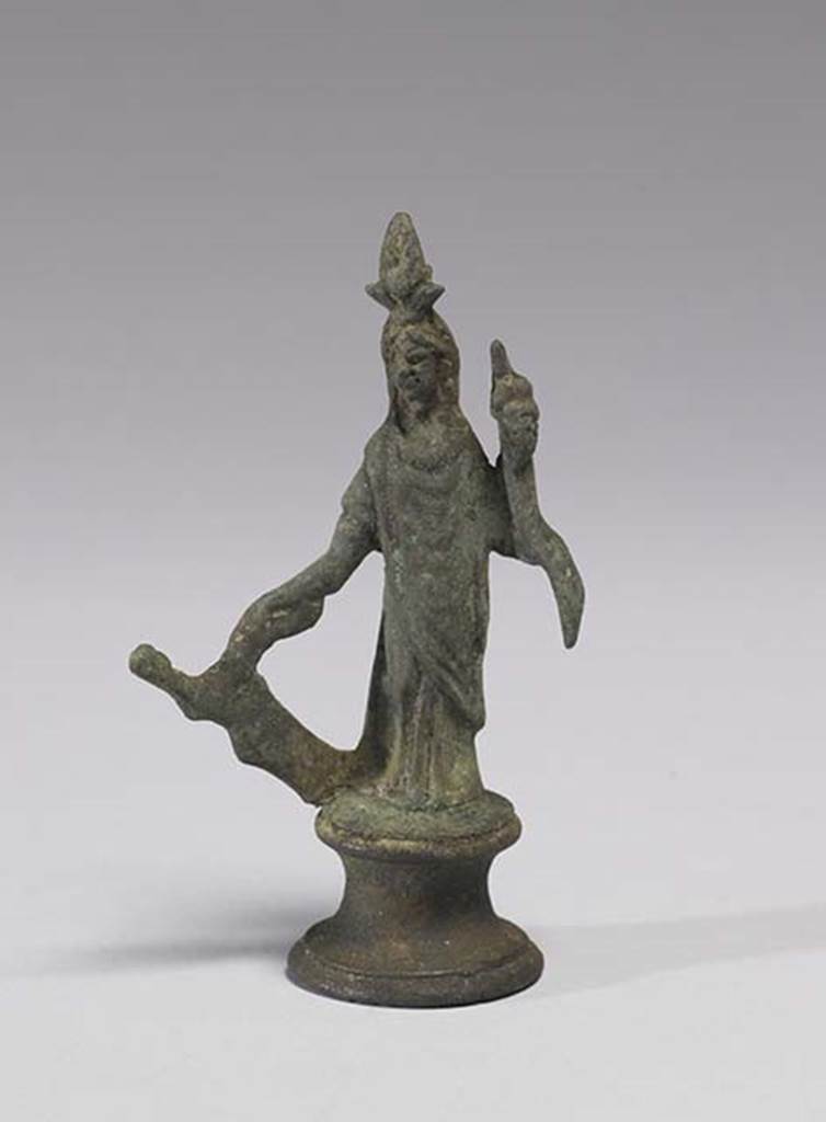 Boscoreale, Villa rustica in fondo D’Acunzo. Room 12, lararium.
Bronze statuette of Isis-Fortuna, 0.09m high including the base, front view.
She is fully clothed and has a crescent moon and a disk surmounted by two plumes upon her forehead.
In her right hand she holds a rudder, in her left hand a cornucopia.
Photo courtesy of The Walters Art Museum, Baltimore. Inventory number 54.747.
http://thewalters.org/
Creative Commons Attribution-ShareAlike 3.0 Unported Licence