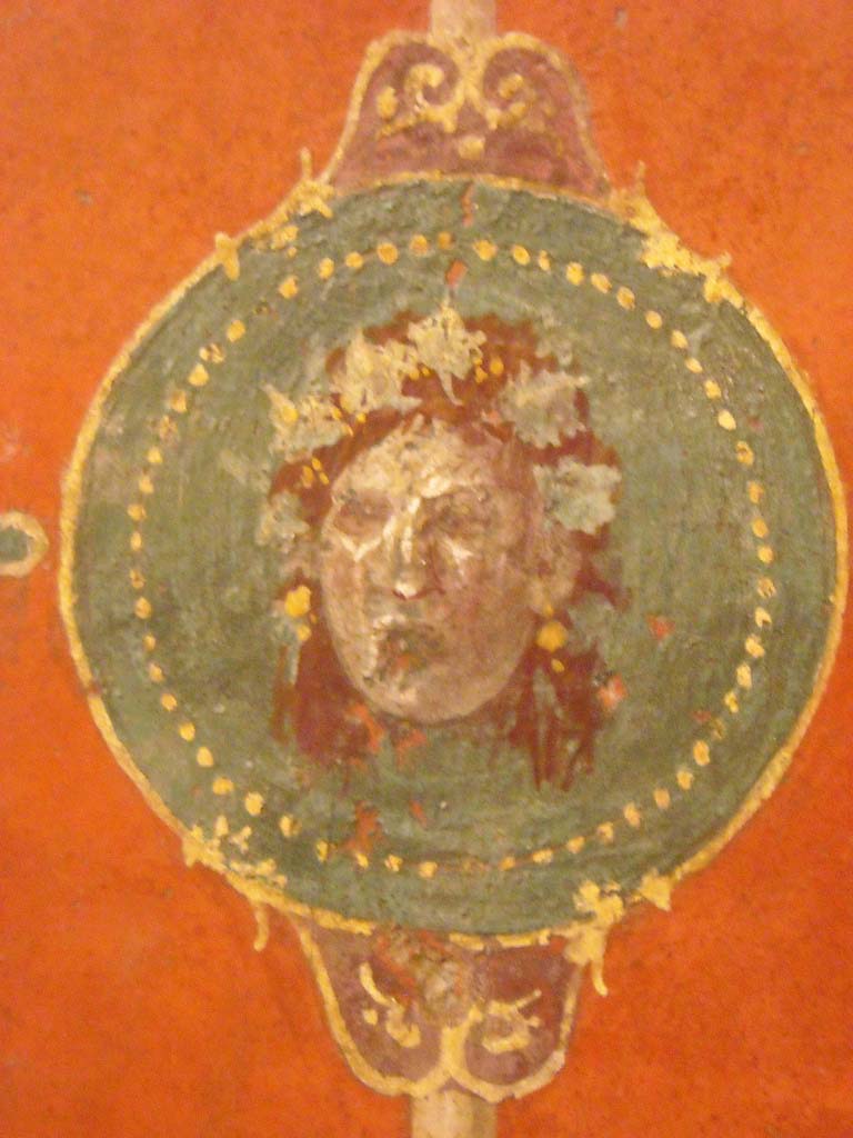 Villa Agrippa Postumus. Boscotrecase.
Room 16, detail of mask from centre of panel on west wall at north end.
Now in Naples Archaeological Museum. Inventory number 147504.