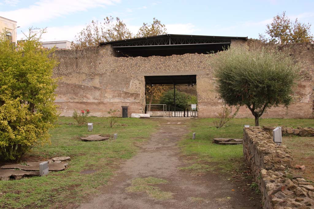 Oplontis Villa of Poppea, October 2020. Looking east along pathway towards doorway to Exedra 69.
The remains of one of Wilhelmina’s root cavity plaster-casts which she proved had been a large clump of shrubs, probably oleanders, can be seen on the left.
Photo courtesy of Klaus Heese.