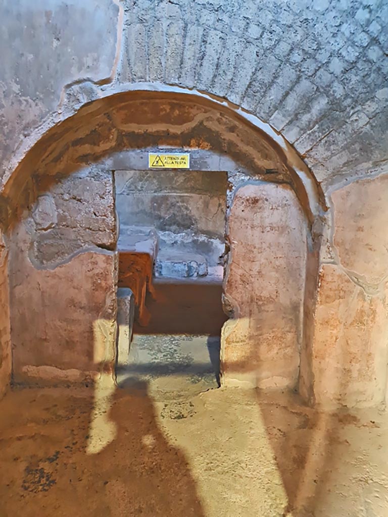 Oplontis Villa of Poppea, October 2023.
Room 7, looking east through doorway with vaulted surround, at western end of kitchen. Photo courtesy of Giuseppe Ciaramella.