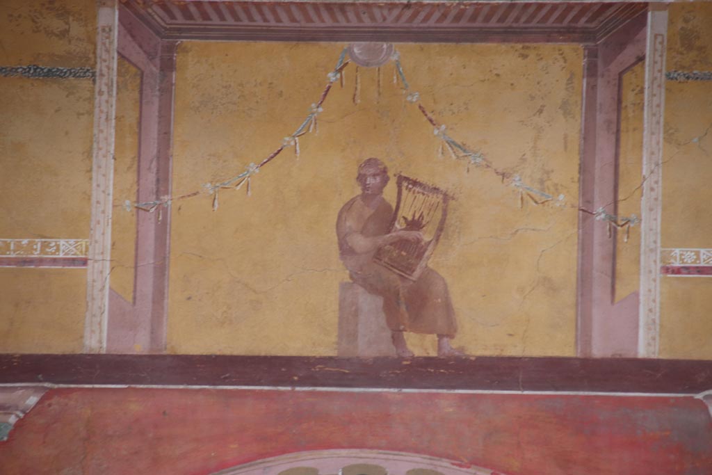 Oplontis Villa of Poppea, October 2022.
Room 8, painted upper centre of east wall with painting of a poet playing the lyre. Photo courtesy of Klaus Heese.