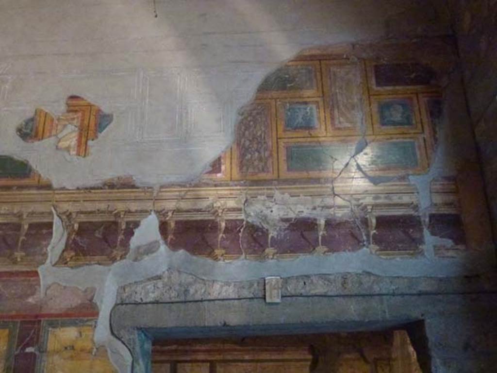 Oplontis Villa of Poppea, September 2011. Room 14, detail of painted wall above doorway in east wall. Photo courtesy of Michael Binns.