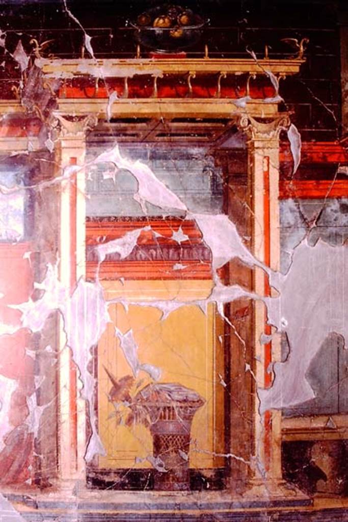Oplontis, 1974. Room 23, at the top of the wall is a still-life of a glass bowl of pomegranates, and below it is a painted basket of fruit covered with a veil.
Photo by Stanley A. Jashemski.
Source: The Wilhelmina and Stanley A. Jashemski archive in the University of Maryland Library, Special Collections (See collection page) and made available under the Creative Commons Attribution-Non Commercial License v.4. See Licence and use details. J74f0651