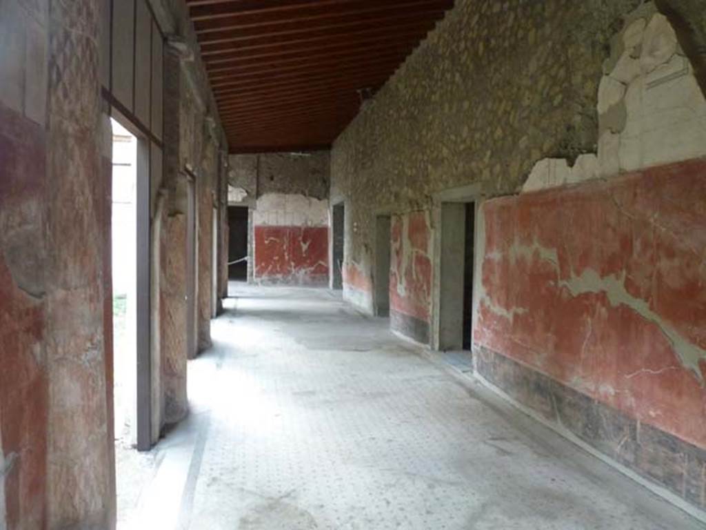 Oplontis Villa of Poppea, September 2015. Portico 24, looking west from east end.
Malandrino describes - “the southern portico with columns painted on the inside and fluted in stucco on the outside.
The spaces between the columns were partially closed by masonry panels to protect both the porticoes themselves as well as the rooms that face onto them, from the summer heat and from the rain and the southerly winds.”
See Malandrino, C. (1978). Oplontis Villa of Poppea, (p. 72), where Room 24, is described as Room 19 on the plan).