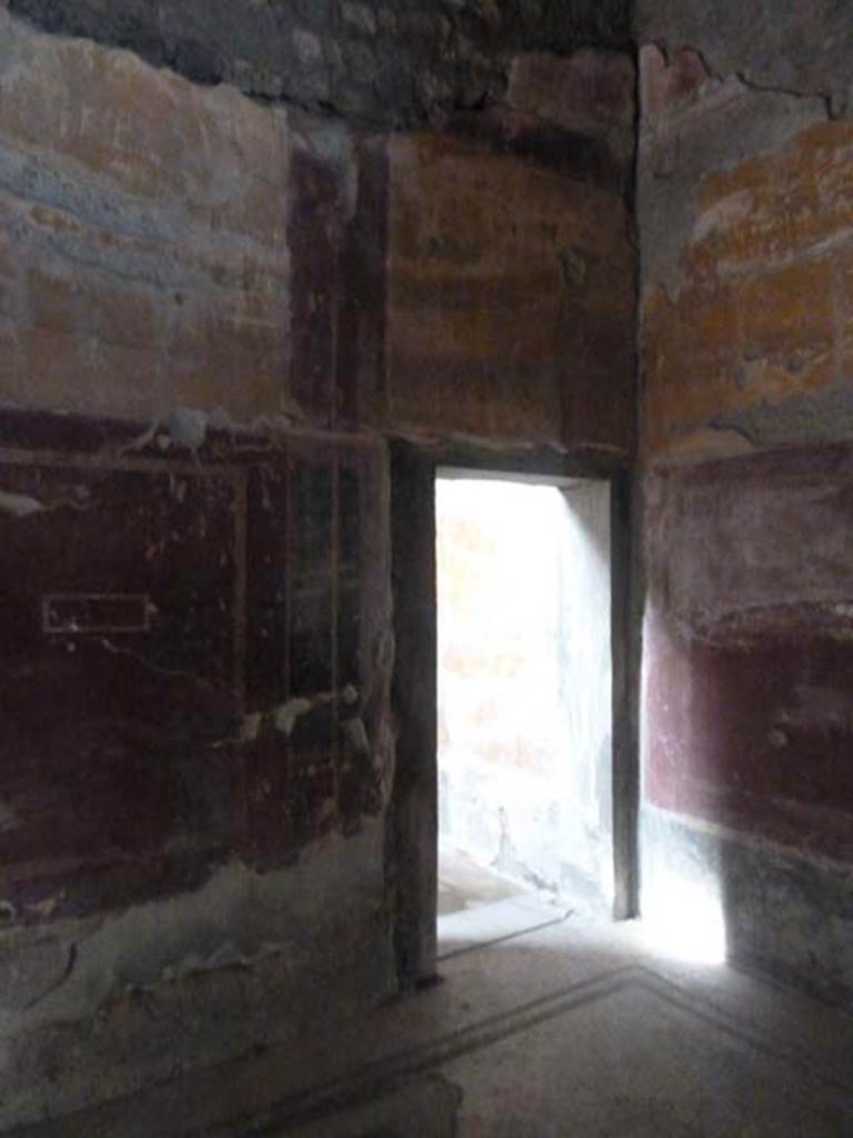 Oplontis, September 2015. Room 31, doorway in west wall of tepidarium, room 18, leading to possible room used as frigidarium.
Secondo a Carlo Malandrino - Ambiente destinato probabilmente a frigidarium del complesso termale. Non interamente portato alla luce, perche coperto, per oltre la meta, dal terrapieno stradale. Vedi Malandrino, Carlo, 1978. “Oplontis”, (p.72, ambiente 18 sulla pianta).
(translation: Room probably used as frigidarium of the baths complex. Not entirely brought to light, because it is covered for over half of it, by the road embankment.)
See Malandrino, Carlo, 1978. “Oplontis”, (p.72, room 18 on plan).