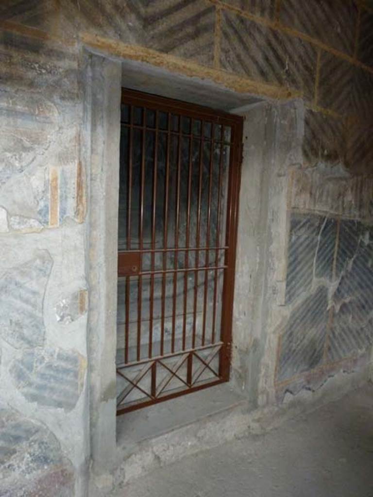 Oplontis, September 2015. Room 32, doorway to room 42, steps to upper floor, on east side of internal peristyle. Steps leading to a mezzanine floor above rooms 43 and 44. The upper floor would have consisted of three small rooms and a corridor.