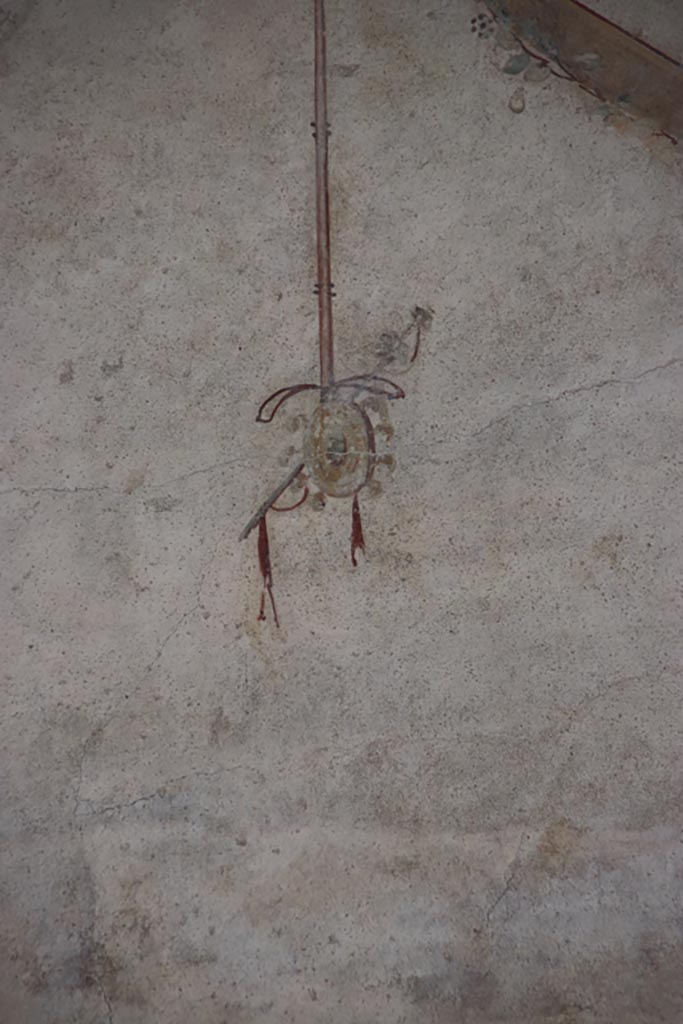 Villa of Poppaea, Oplontis, October 2023.
Area 60, detail of painted decoration from west portico wall, on left above doorway to room 72.
Photo courtesy of Klaus Heese.