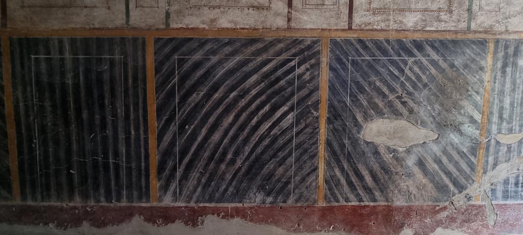 Oplontis Villa of Poppea, January 2023. Corridor 76, detail of lower west wall. Photo courtesy of Miriam Colomer.