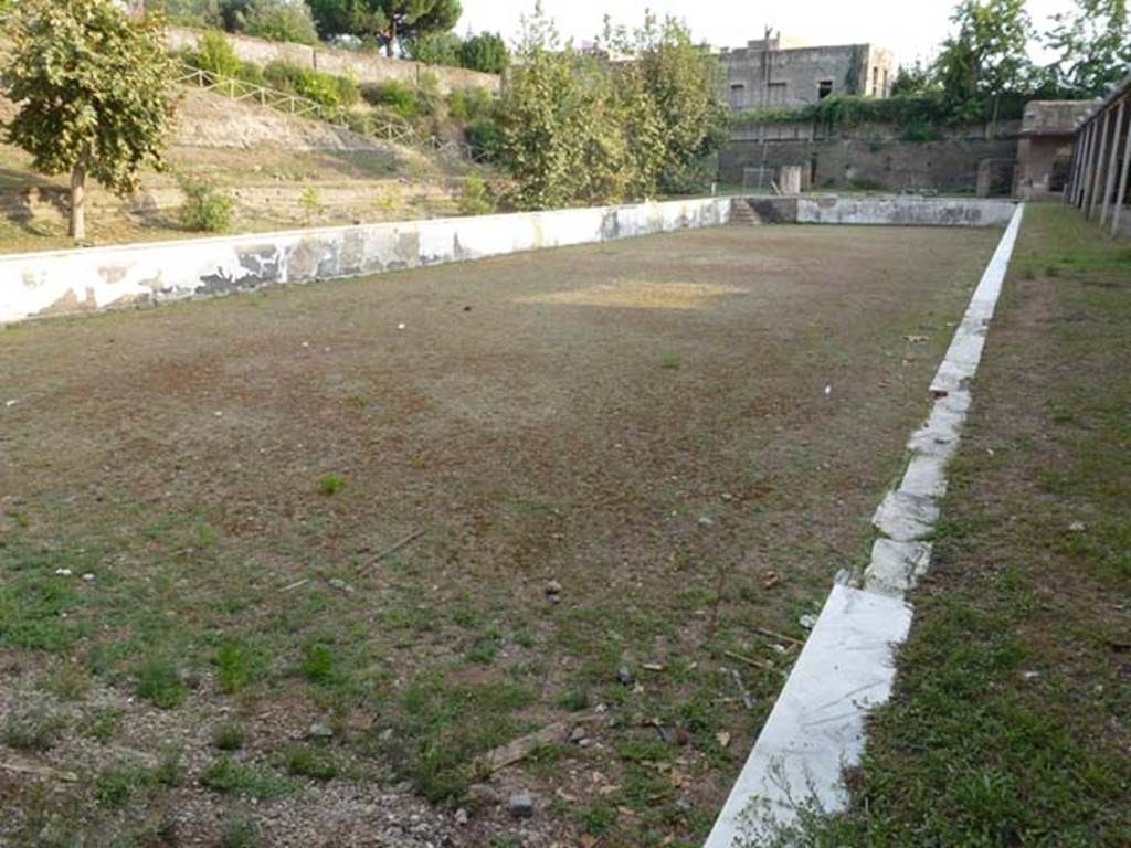 Oplontis Villa of Poppea, September 2011. Area 80 and swimming pool 96, Looking south from north end of west portico.
Photo courtesy of Michael Binns.