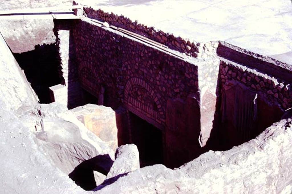 Oplontis, 1977. Room 87, south side during reconsolidation. The semi-circular window built into the north wall can be seen on the lower-left. Photo by Stanley A. Jashemski.
Source: The Wilhelmina and Stanley A. Jashemski archive in the University of Maryland Library, Special Collections (See collection page) and made available under the Creative Commons Attribution-Non Commercial License v.4. See Licence and use details. J77f0396