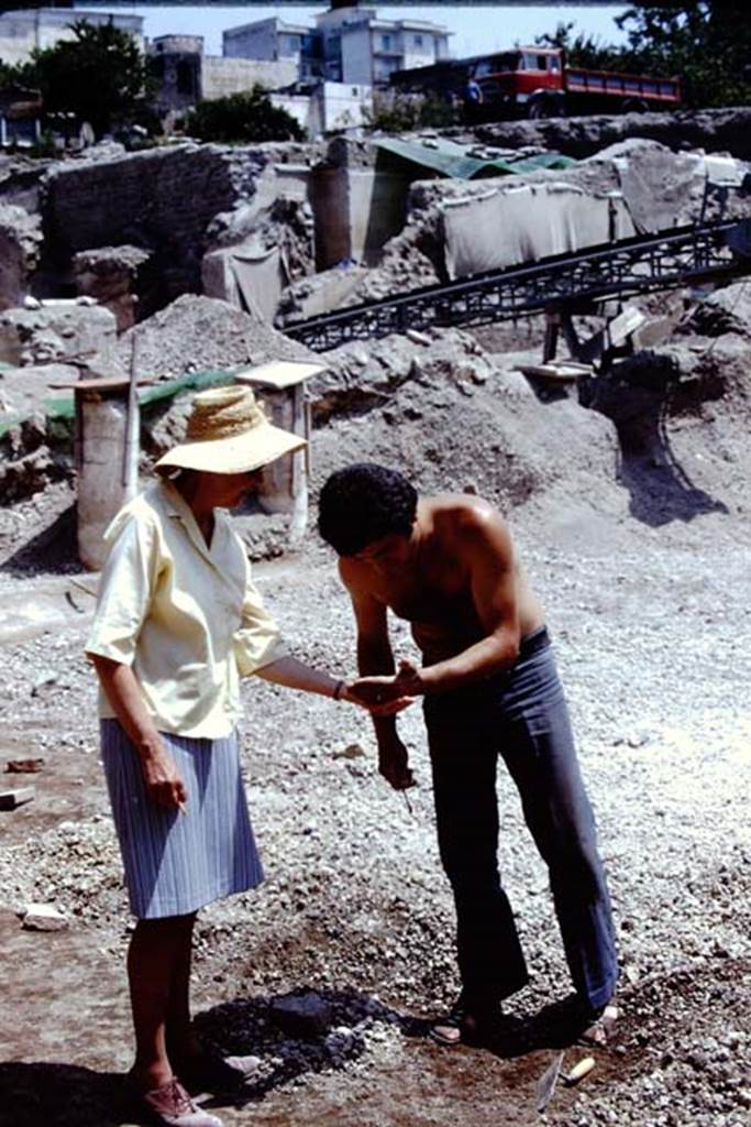 Oplontis Villa of Poppea, 1975 or 1974. A discovery in the lapilli ! Looking north-east to rear of area 59, the south-east peristyle. Photo by Stanley A. Jashemski.
Source: The Wilhelmina and Stanley A. Jashemski archive in the University of Maryland Library, Special Collections (See collection page) and made available under the Creative Commons Attribution-Non Commercial License v.4. See Licence and use details. J74f0870