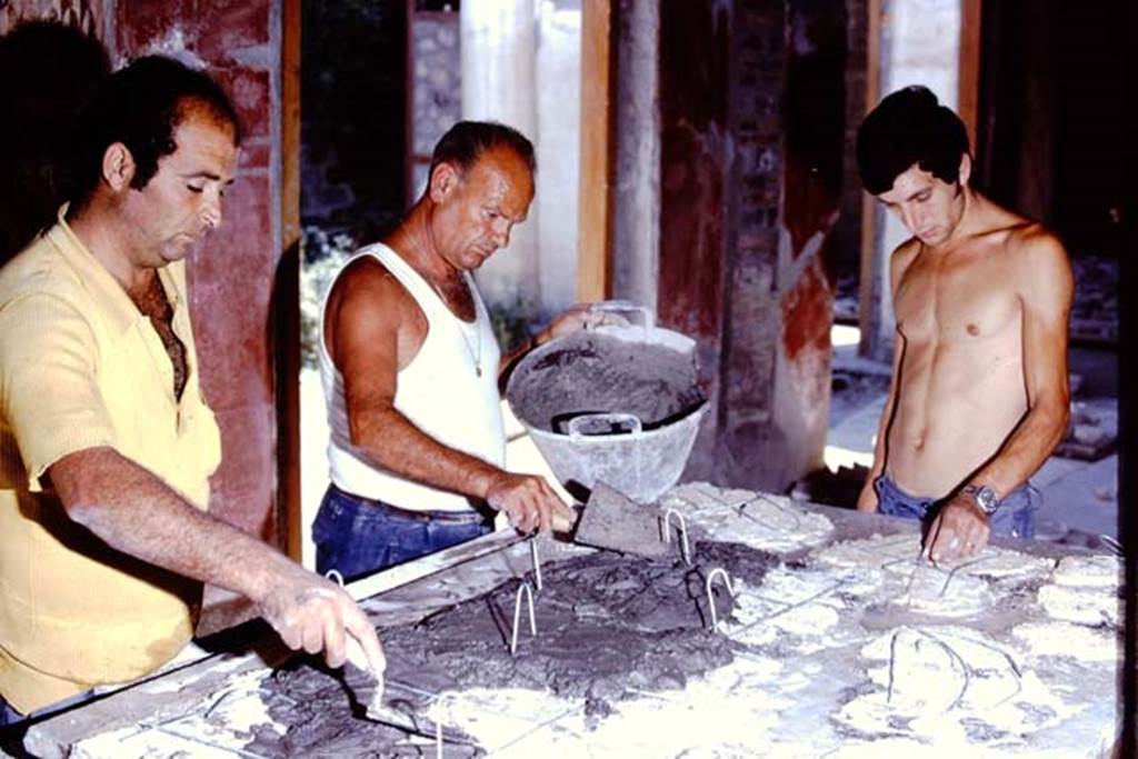 Oplontis Villa of Poppea, 1975 or 1974. Concentration, while applying the cement to the rear of the fallen fragments. Photo by Stanley A. Jashemski.
Source: The Wilhelmina and Stanley A. Jashemski archive in the University of Maryland Library, Special Collections (See collection page) and made available under the Creative Commons Attribution-Non Commercial License v.4. See Licence and use details. J74f0888