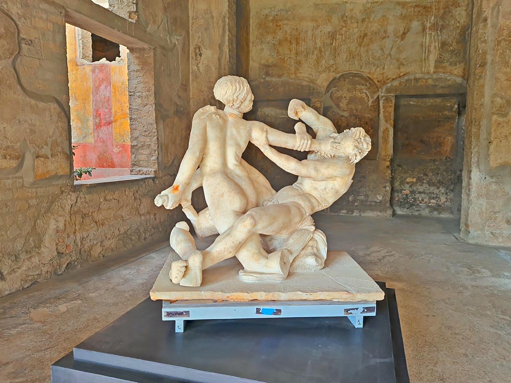 Oplontis Villa of Poppea, October 2023. Room 74, looking south-west towards window into garden room 70, on left.
The marble group of Hermaphrodite and Satyr, on display here, were found on the south side of the pool. Photo courtesy of Giuseppe Ciaramella.