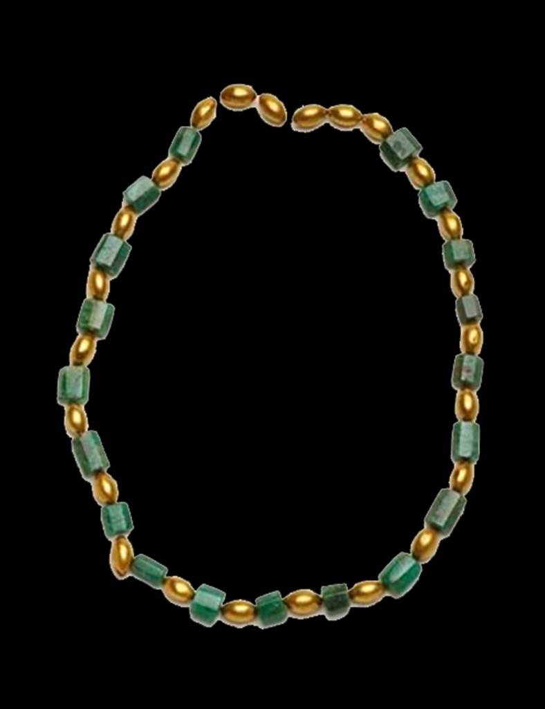 Oplontis, Villa of Lucius Crassius Tertius. Gold and emerald armlet found on a skeleton in 1984.
According to D’Ambrosio,
“Oltremodo ricco di monili d’oro il n.27 ; tra questi un’armilla con il castone decorato a rilievo con una Venere  ed amorino, 3 anelli, 2 coppia di orecchini, una collana con vaghi ovali in lamina d’oro alternati a prismi di smeraldo, una collana d’oro”.
Skeleton no. 27 was extremely rich in gold jewellery; among them one ring with the bezel decorated in relief with a Venus and Cupid, 3 rings, 2 pair of earrings, a necklace with vague oval in gold foil alternating with prisms of emerald, a gold necklace.
See D’Ambrosio A., 1987. Rivista di Studi Pompeiana I, p. 176.
