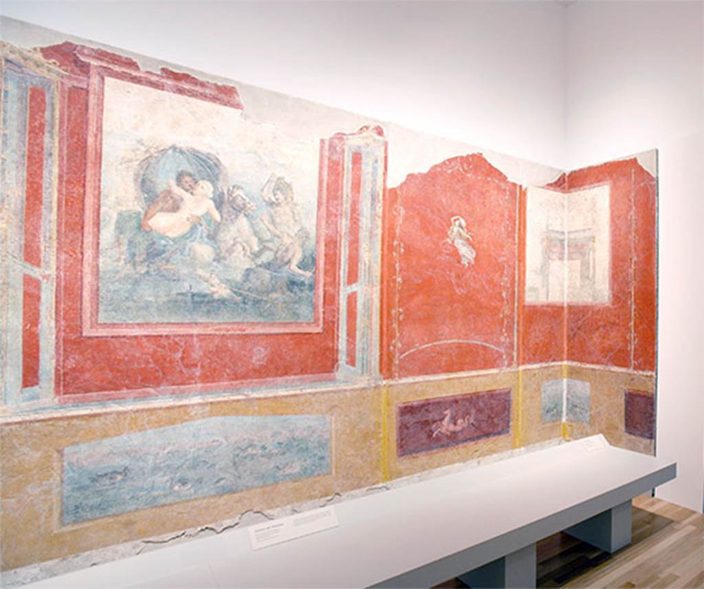 Gragnano, Villa rustica in Località Carmiano, Villa A. Triclinium 1.
West wall with fresco of Neptune and Amymone and architectural painting continuing round the north-west corner.
According to Eristov, the unique vista contained in the architectural angle tends to eliminate the actual quadrangular space in favour of a fictitiously octagonal space, the false sides of which open in impossible windows.
Such painting, with its moving continuity of processions and the abolition of the corners seems a unique case within Campanian painting.
See Eristov H., 1978. A propos d’une peinture de Carmiano a l’Antiquarium di Castellammare di Stabia. Latomus, 37, 1978, pp. 632.