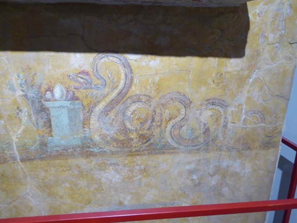 Gragnano, Villa rustica in Località Carmiano, Villa A. June 2017. Underneath the aedicula lararium, a painted serpent is moving towards an altar on which was an egg and other offerings.
Photo courtesy of Michael Binns.