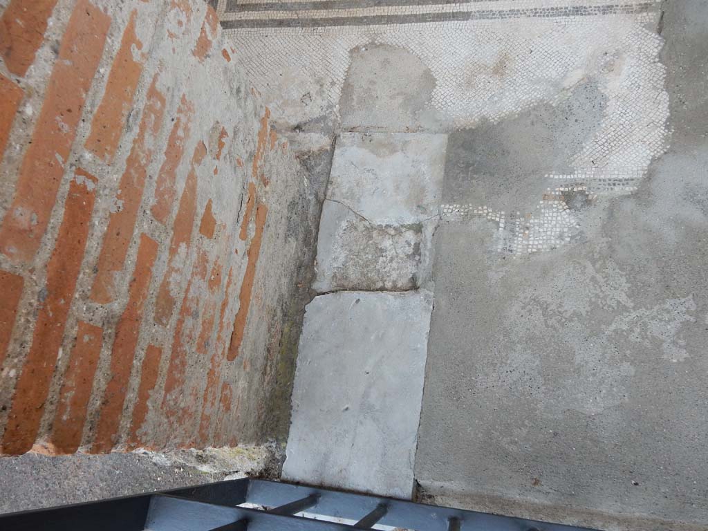 Stabiae, Villa Arianna, June 2019. Room A, detail of doorway threshold at east end of floor. Photo courtesy of Buzz Ferebee.