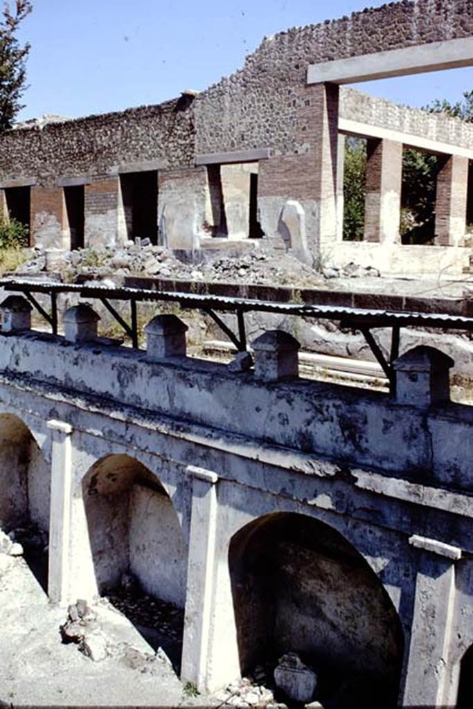 Villa Arianna, 1968. Doorway to the large windowed exedra room A, on right, and rooms on its east side, above the arched wall on the terrace. Photo by Stanley A. Jashemski
Source: The Wilhelmina and Stanley A. Jashemski archive in the University of Maryland Library, Special Collections (See collection page) and made available under the Creative Commons Attribution-Non Commercial License v.4. See Licence and use details. Jmis0092