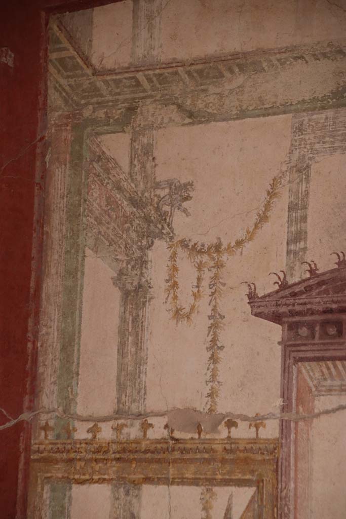 Stabiae, Villa Arianna, October 2020.
Room 7, detail on upper painted panel above figure, at south end of west wall. Photo courtesy of Klaus Heese.