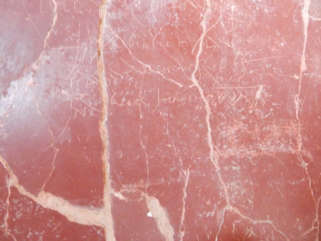 Stabiae, Villa Arianna, June 2019. W.28, graffiti on south wall to right of painted female figure. Photo courtesy of Buzz Ferebee.