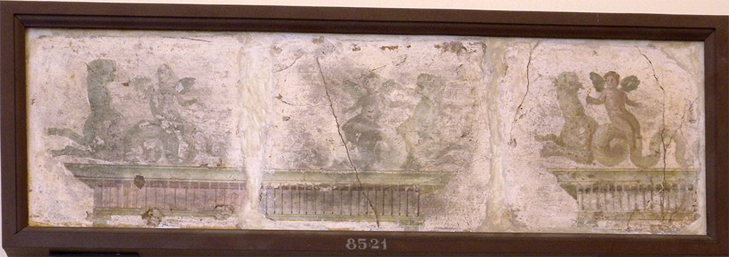 Stabiae, Villa Arianna, found 16th July 1759. Room W.24.
These three fragments were assembled in a single frame after detachment from the walls of the room in which they were found in July 1759
Each fragment of wall painting has a cupid riding a sea panther.
The second is symmetrical to the first and is probably part of the same aedicula.
The third is the same group and pose as the first, but the cupid has natural colours.
Now in Naples Archaeological Museum. Inventory number 8521.
See Sampaolo V. and Bragantini I., Eds, 2009. La Pittura Pompeiana. Electa: Verona, p. 487.
See Pagano, M. and Prisciandaro, R., 2006. Studio sulle provenienze degli oggetti rinvenuti negli scavi borbonici del regno di Napoli. Naples: Nicola Longobardi, p. 243.
