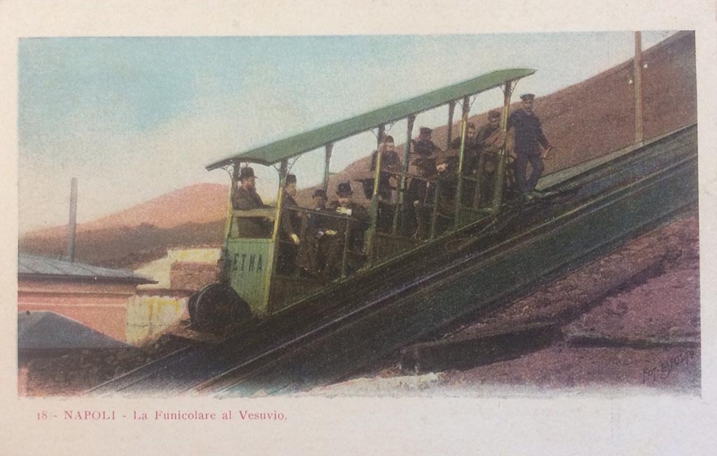 Postcard showing the Vesuvius Funicular car Etna. Not dated, but with interesting handwritten note on rear -
“The original 1880 Funicular had 2 cars ETNA and VESUVIO”. Photo courtesy of Rick Bauer.
This is one of two new cars, also named Etna and Vesuvio, but seating 10 people, introduced in 1889 as part of renovations by John Mason Cook.