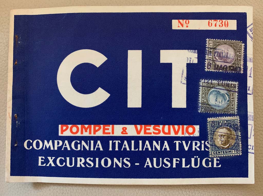 Cover of an old carnet for excursions to Vesuvius and Pompeii. It’s hard to read the date on the stamps. It looks like 6 May 1940
According to Rick –
“A May 1940 date is very feasible.
The Compagnia Italiana Turismo was set up in 1927 by the Fascists and ran until 2008.
The portrait on the stamps is Victor Emmanuel III who abdicated in 1946.
The Italian State was actively promoting tourism up to 1943.
The Funiculare was out of action from 1944 to 1947 and was replaced by the chairlift in 1953.”
Photo courtesy of Rick Bauer.