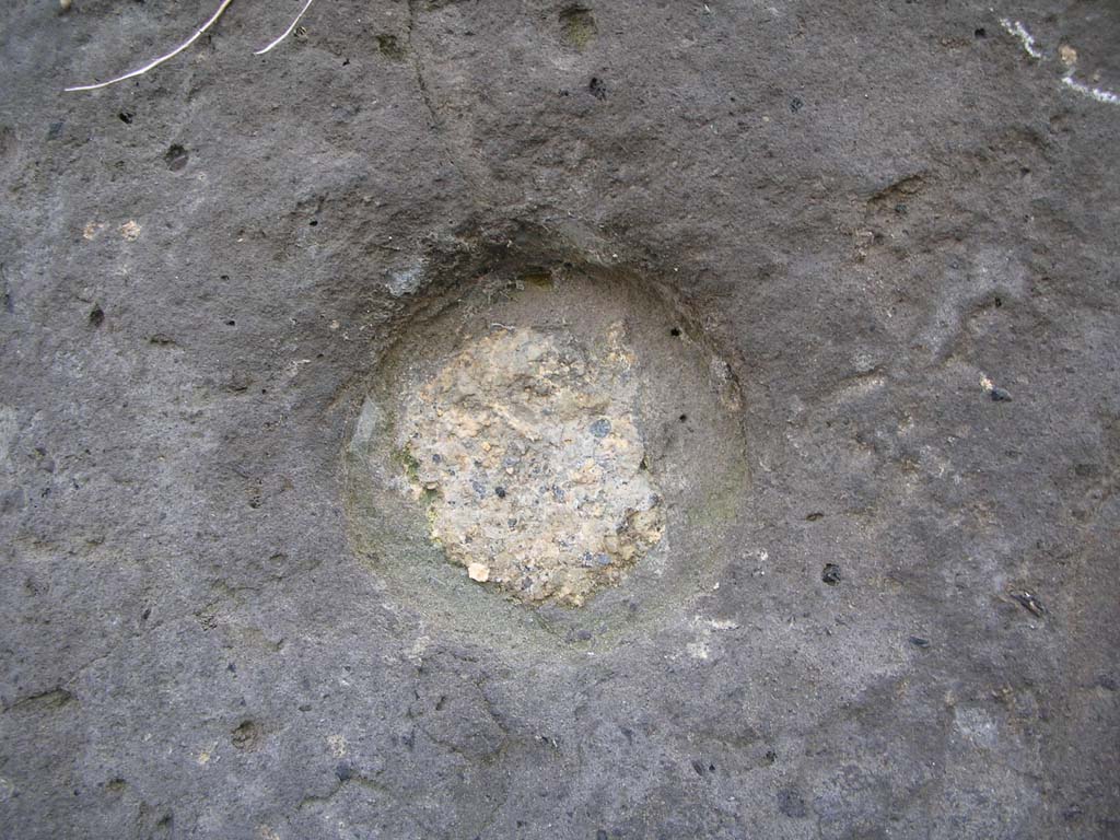 Vesuvian Gate, Pompeii. May 2010. 
Detail of missile indentation from war machines of Sulla, on west side of Gate at north end. Photo courtesy of Ivo van der Graaff.
